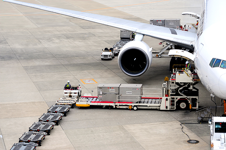 air freight containers loading on a plane